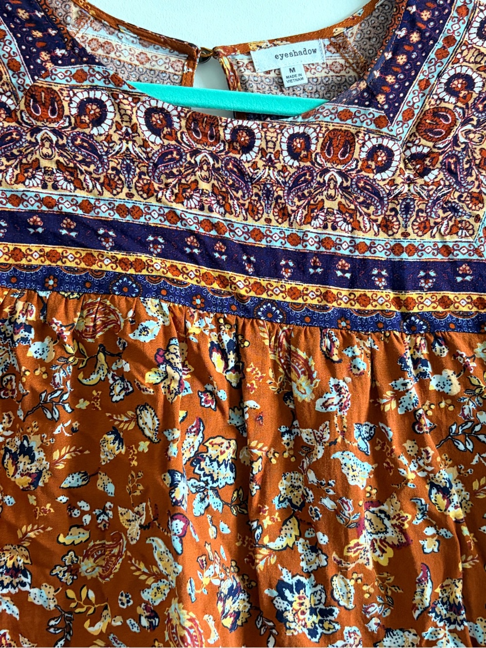 Eyeshadow Burnt Orange Floral Peasant Blouse with Navy Accents - Picture 2 of 5